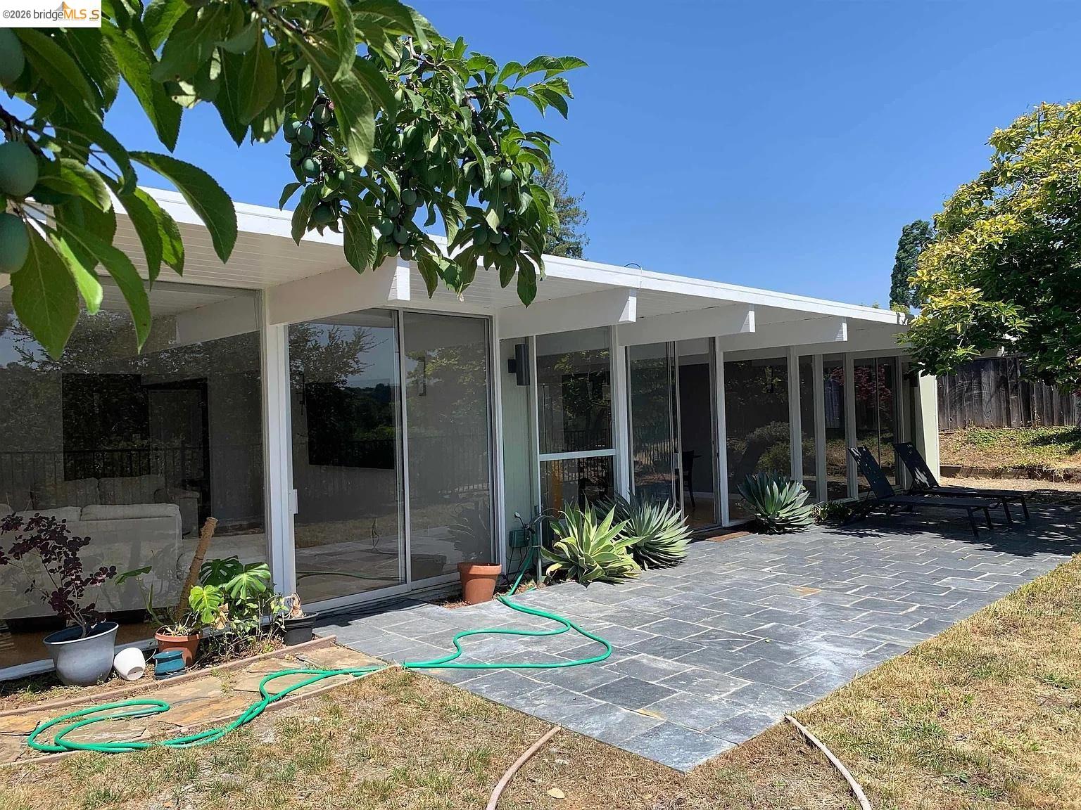5559 Greenridge Road Castro Valley, CA 94552 - Photo 26 of 33 Rear view of property featuring a sunroom