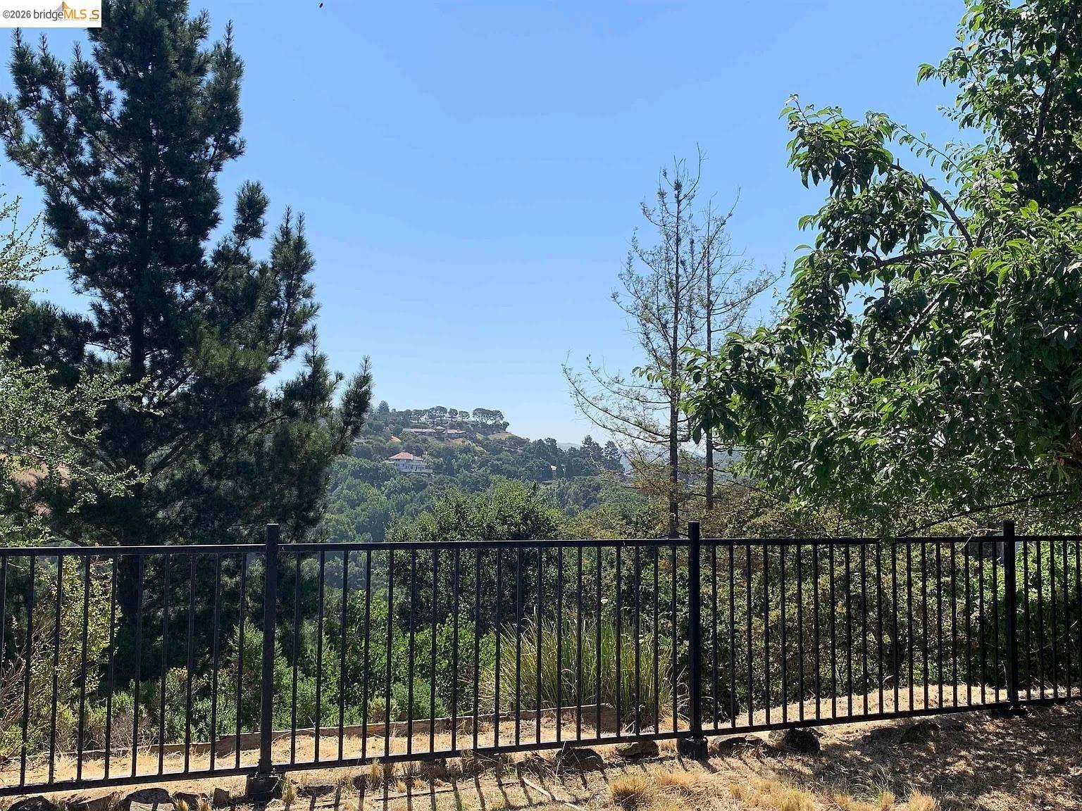 5559 Greenridge Road Castro Valley, CA 94552 - Photo 31 of 33 View of yard with a wooded view