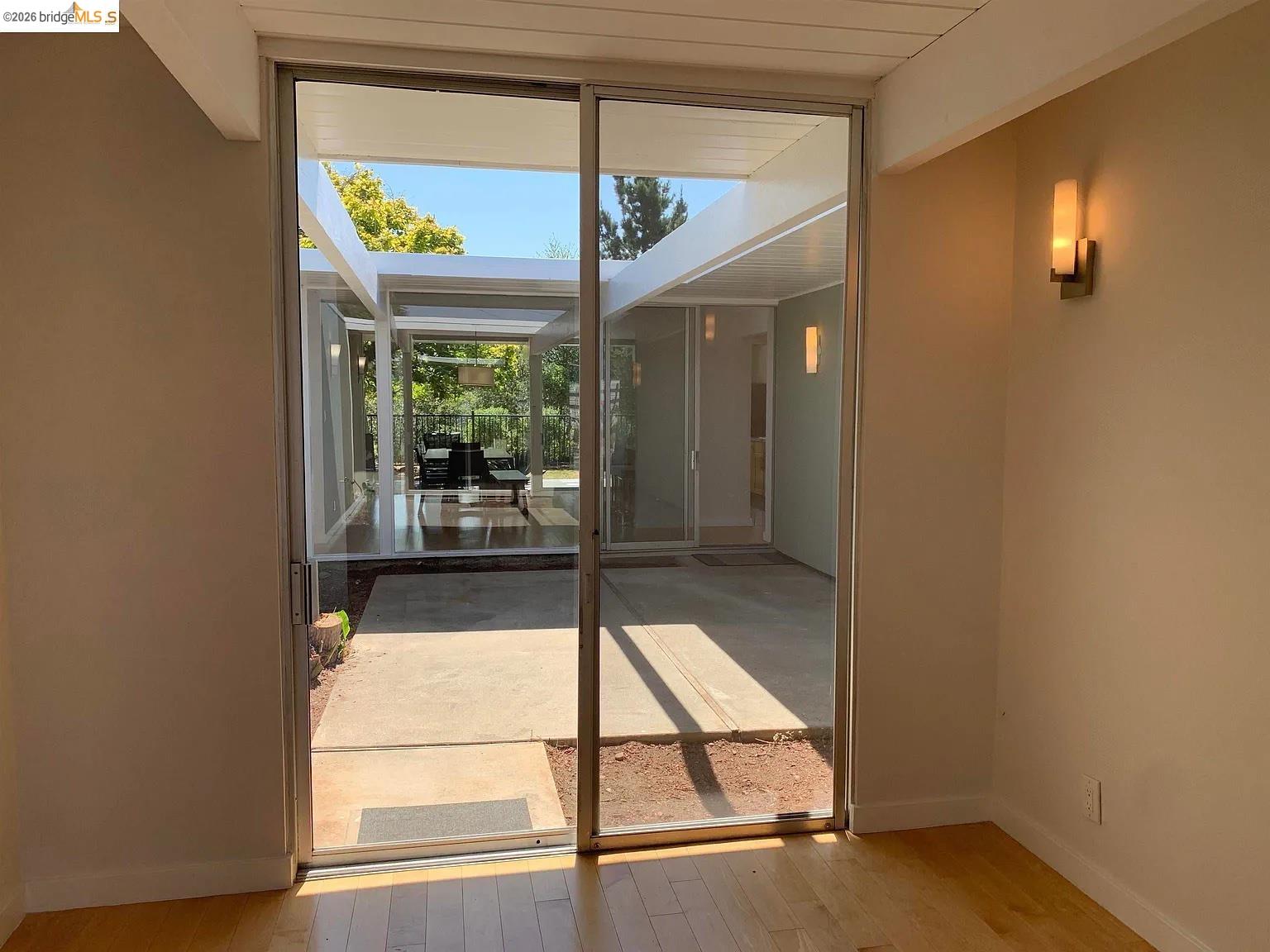 5559 Greenridge Road Castro Valley, CA 94552 - Photo 6 of 33 Doorway with baseboards and wood-type flooring