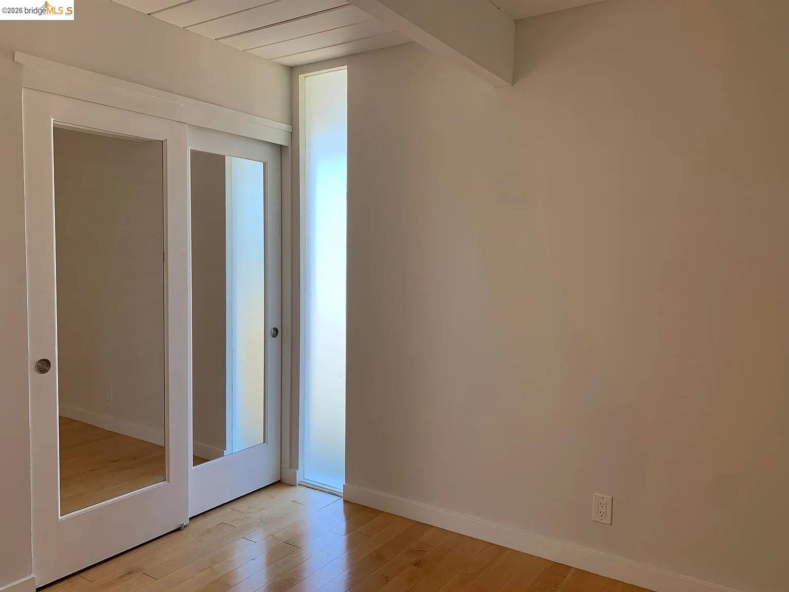 5559 Greenridge Road Castro Valley, CA 94552 - Photo 7 of 33 Unfurnished bedroom featuring light wood finished floors and baseboards