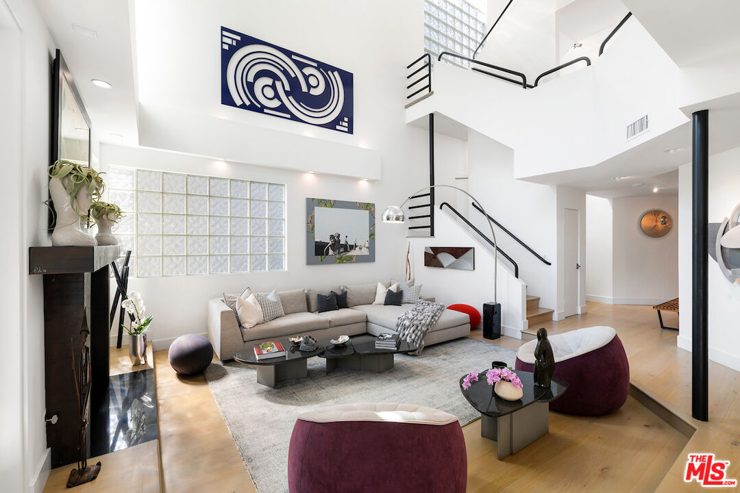 135 Mast Mall Marina del Rey, CA 90292 - Photo 3 of 32 a living room with furniture and a chandelier