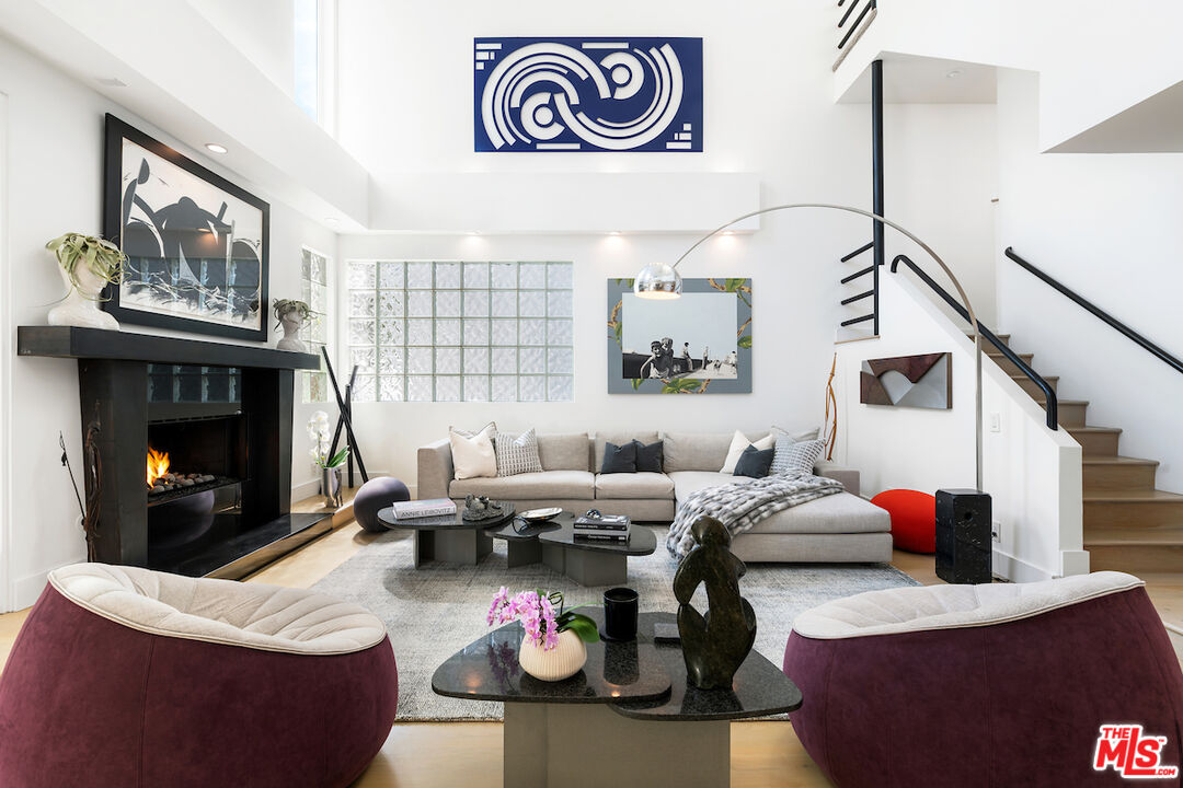 135 Mast Mall Marina del Rey, CA 90292 - Photo 4 of 32 a living room with furniture and a fireplace