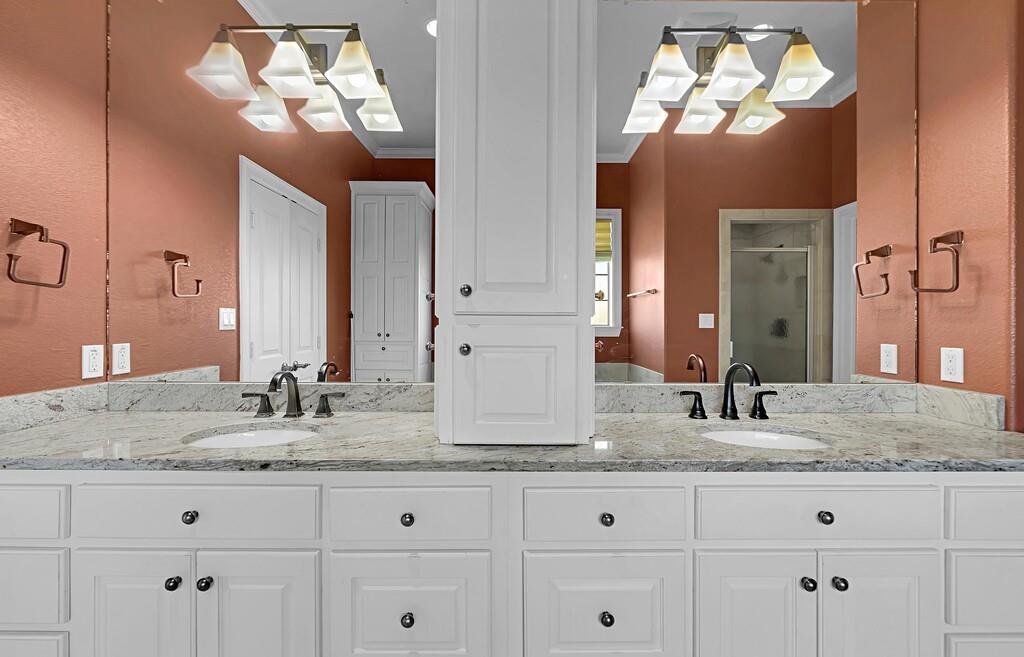 74 Independence Trail Waco, TX 76708 - Photo 20 of 40 a bathroom with a granite countertop double vanity sink and mirror