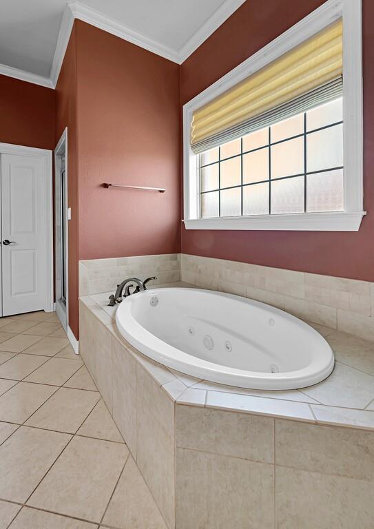 74 Independence Trail Waco, TX 76708 - Photo 21 of 40 a white bath tub sitting next to a window
