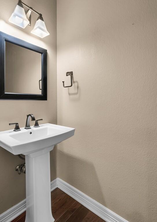 74 Independence Trail Waco, TX 76708 - Photo 24 of 40 a bathroom with a sink a mirror and vanity