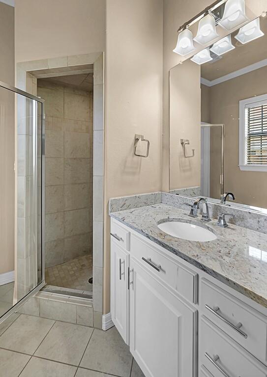 74 Independence Trail Waco, TX 76708 - Photo 26 of 40 a bathroom with a granite countertop sink and a mirror