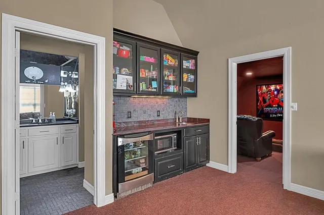 a kitchen with stainless steel appliances granite countertop a stove and a refrigerator