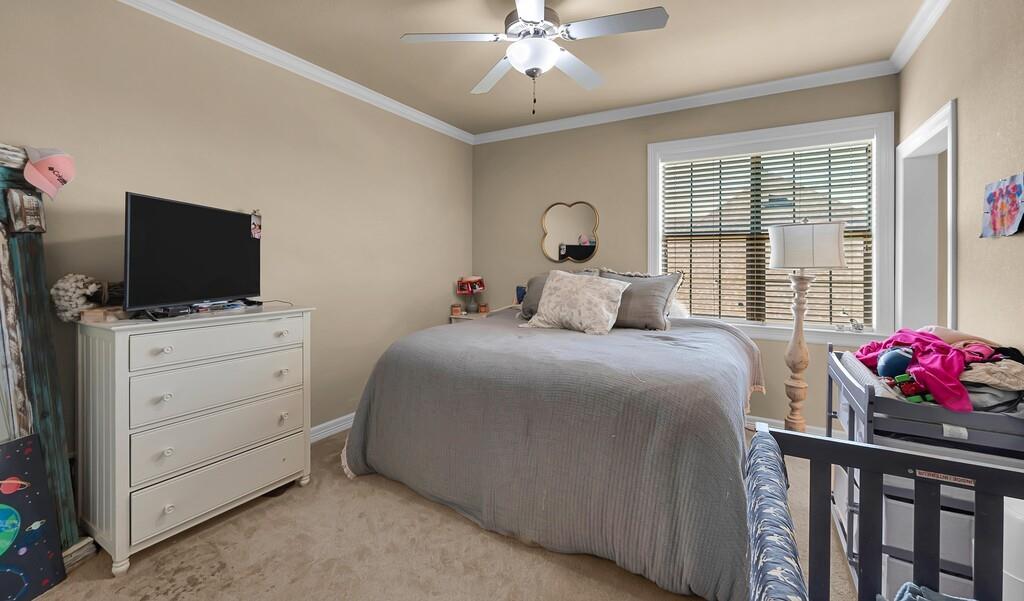 74 Independence Trail Waco, TX 76708 - Photo 34 of 40 a bedroom with a bed and flat screen tv