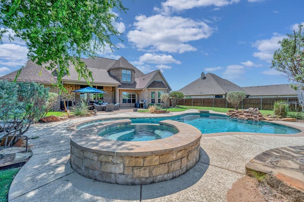 74 Independence Trail Waco, TX 76708 - Photo 39 of 40 a view of a house with swimming pool and a yard