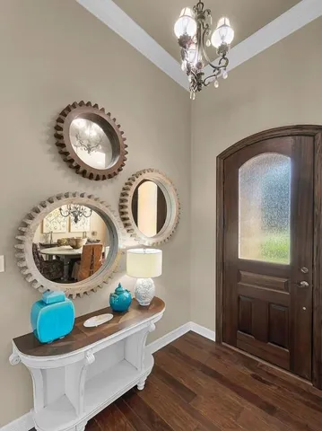 a living room with furniture and a mirror