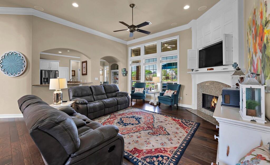 74 Independence Trail Waco, TX 76708 - Photo 5 of 40 a living room with furniture a flat screen tv and a fireplace