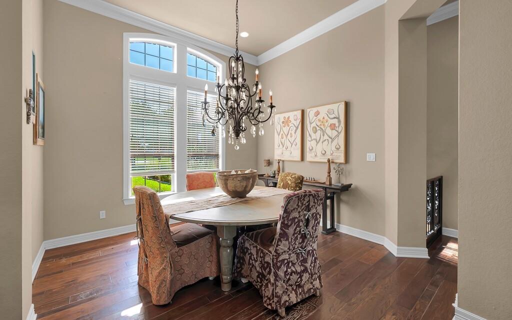 74 Independence Trail Waco, TX 76708 - Photo 8 of 40 a view of a dining room with furniture window and wooden floor
