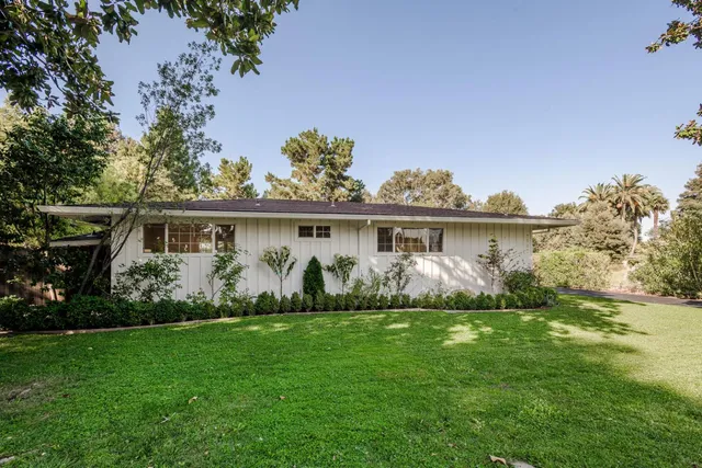 a view of a house with garden
