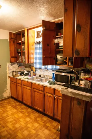 a kitchen with a stove and a microwave