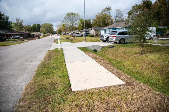 a swimming pool with outdoor seating and yard