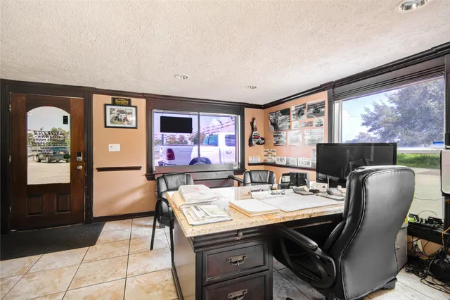 a view of a dining room with furniture and window