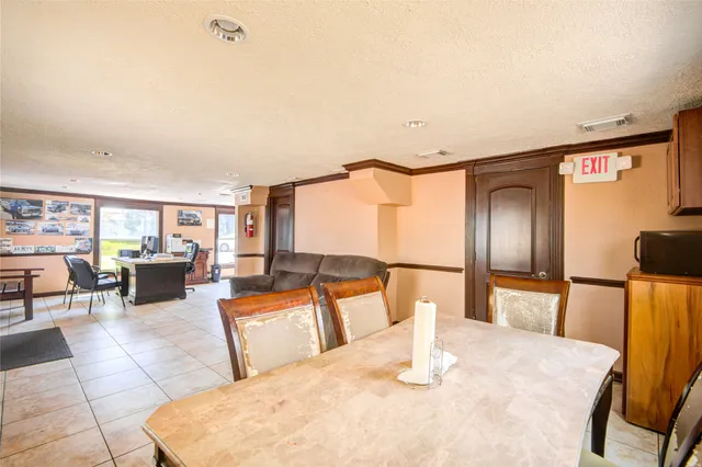 a bedroom with furniture and a large mirror