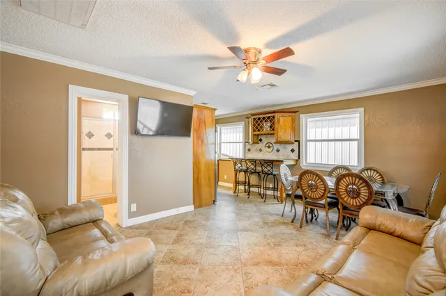 a living room with furniture and a window