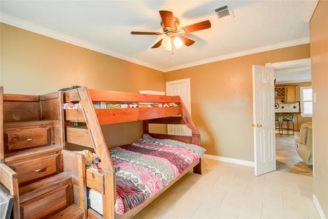 a bedroom with a bed and a view of bathroom