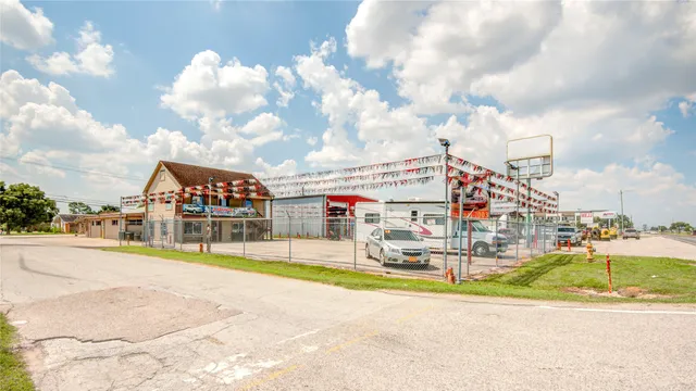 a multi story building with trees in the background