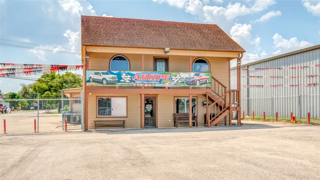 front view of a house with a swimming pool