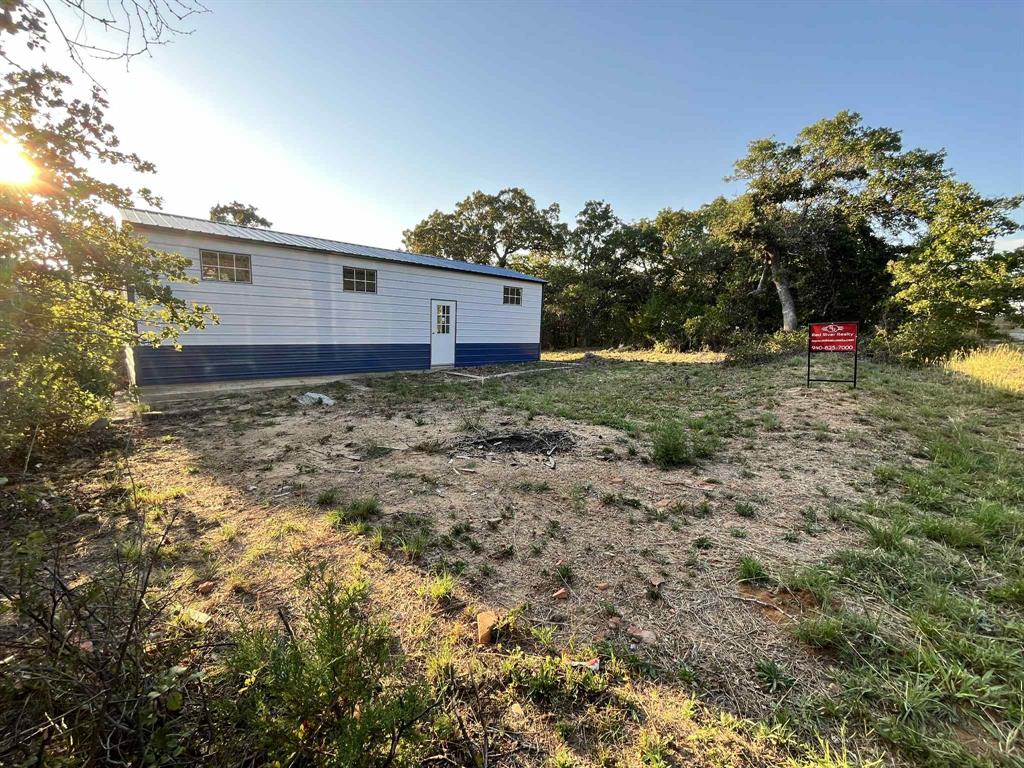 347 Pine Road Nocona, TX 76255 - Photo 4 of 21 a view of a backyard