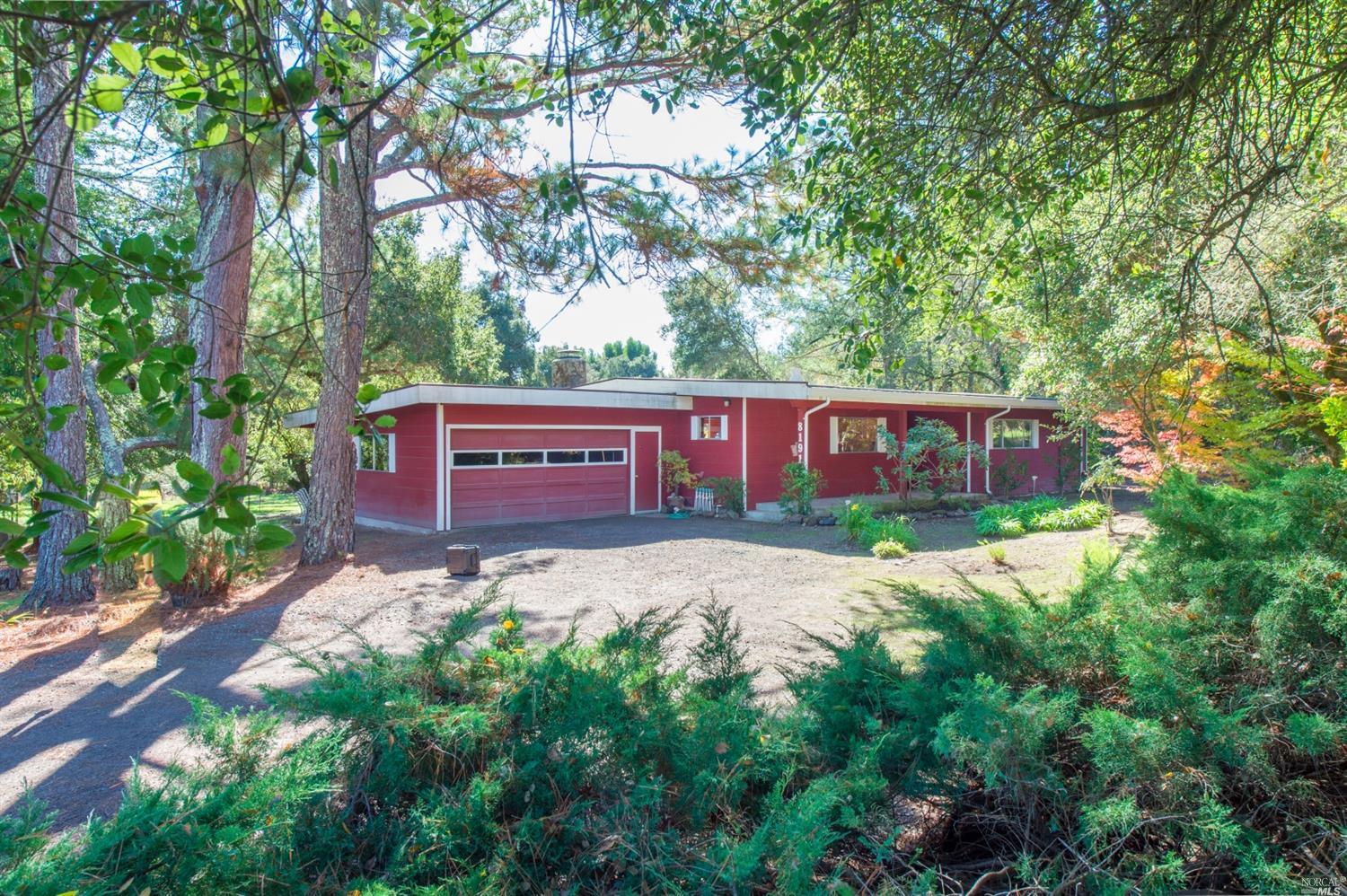 8197 Mill Station Road Sebastopol, CA 95472 - Photo 1 of 1 a view of a yard with red sign board