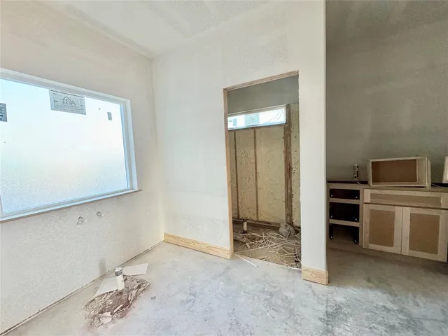 a view of living room with granite countertop furniture and a fireplace