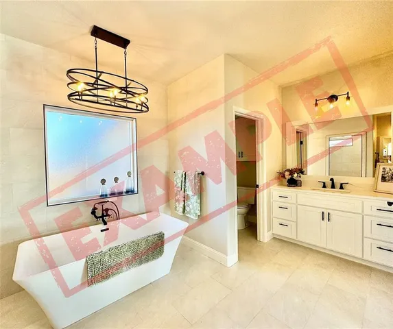 a view of an empty room with cabinet and workspace