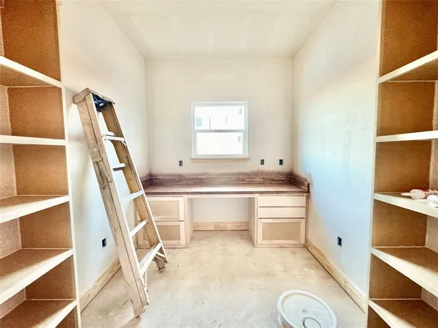 a view of cabinets and wooden floor