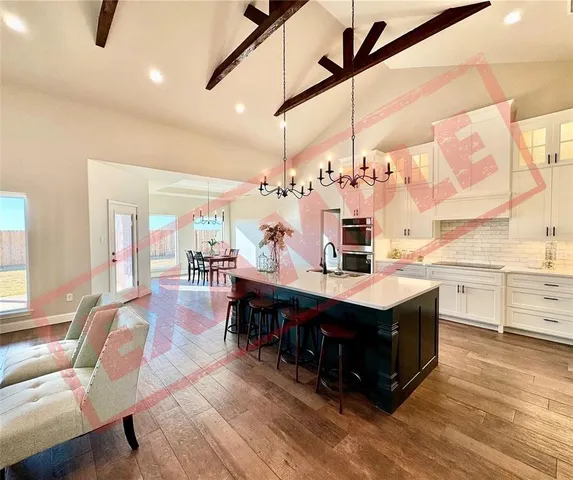 a view of a livingroom with furniture and a window