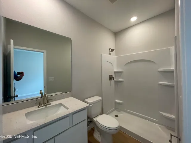 a kitchen with kitchen island a sink stainless steel appliances and window