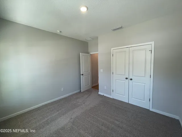 a bathroom with a sink toilet and mirror