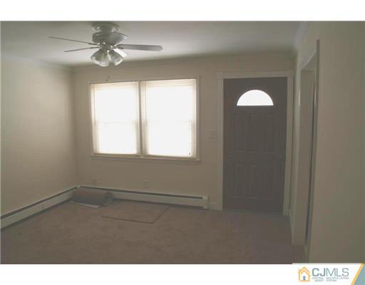 495 Harding Road Old Bridge, NJ 08879 - Photo 4 of 11 a view of an empty room with a window
