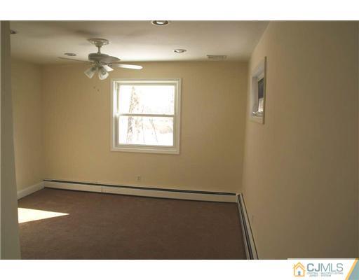 495 Harding Road Old Bridge, NJ 08879 - Photo 5 of 11 a view of an empty room with a window