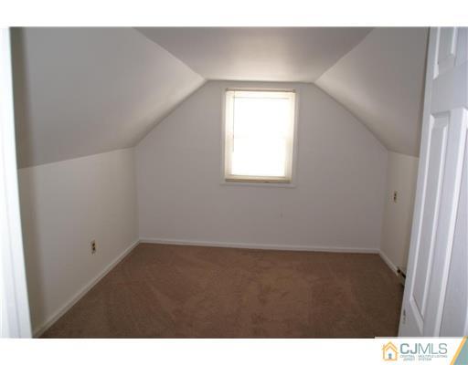 495 Harding Road Old Bridge, NJ 08879 - Photo 7 of 11 a view of an empty room with a window