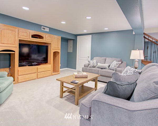 2219 West Bench Road Othello, WA 99344 - Photo 23 of 25 a living room with furniture and a flat screen tv