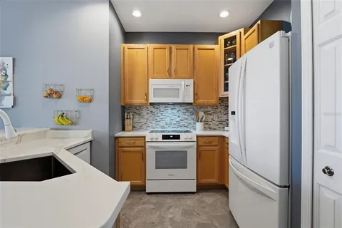 a spacious bedroom with a bed and a mirror