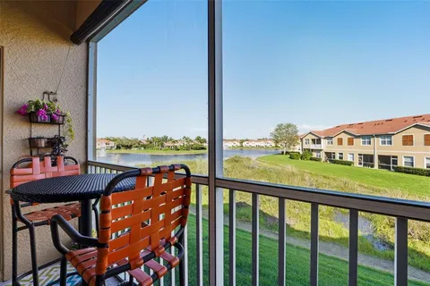 a blue room with a couch and a flat screen tv