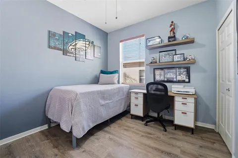 a bathroom with a granite countertop bathtub sink vanity mirror and toilet