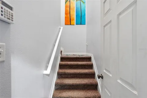 an aerial view of a house with a yard and garden