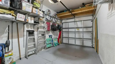 an aerial view of residential houses with outdoor space and lake view