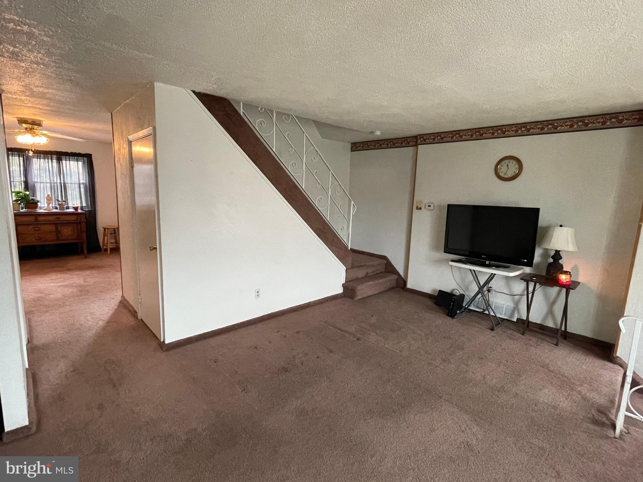 12406 Medford Road Philadelphia, PA 19154 - Photo 5 of 24 Family Room to dining room and stairs to 2nd floor
