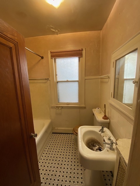 3019 North Kenneth Avenue Chicago, IL 60641 - Photo 11 of 21 a bathroom with a sink and toilet