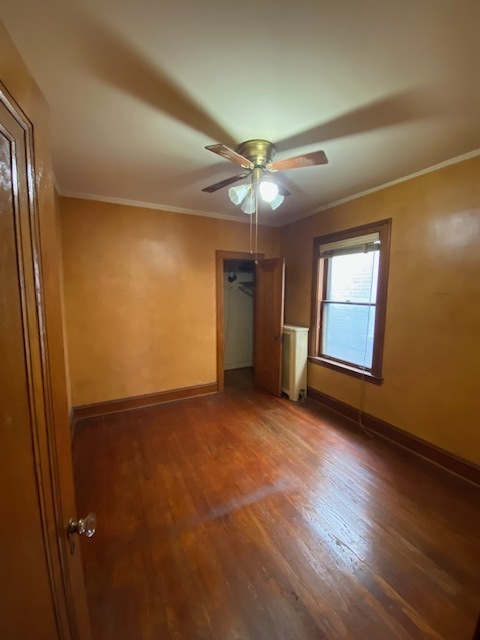 3019 North Kenneth Avenue Chicago, IL 60641 - Photo 12 of 21 an empty room with windows and fan