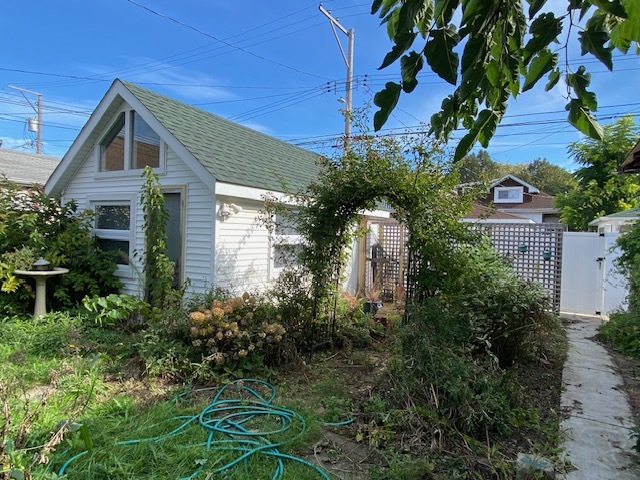 3019 North Kenneth Avenue Chicago, IL 60641 - Photo 19 of 21 a front view of a house with garden