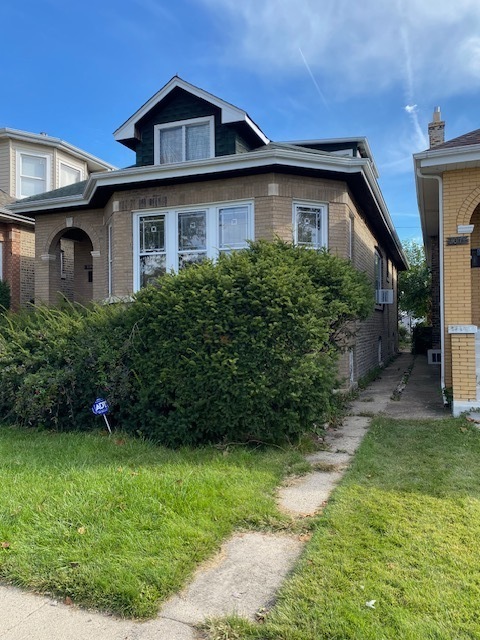 3019 North Kenneth Avenue Chicago, IL 60641 - Photo 2 of 21 a front view of a house with a yard
