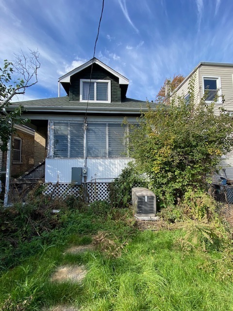 3019 North Kenneth Avenue Chicago, IL 60641 - Photo 3 of 21 a front view of a house with a yard