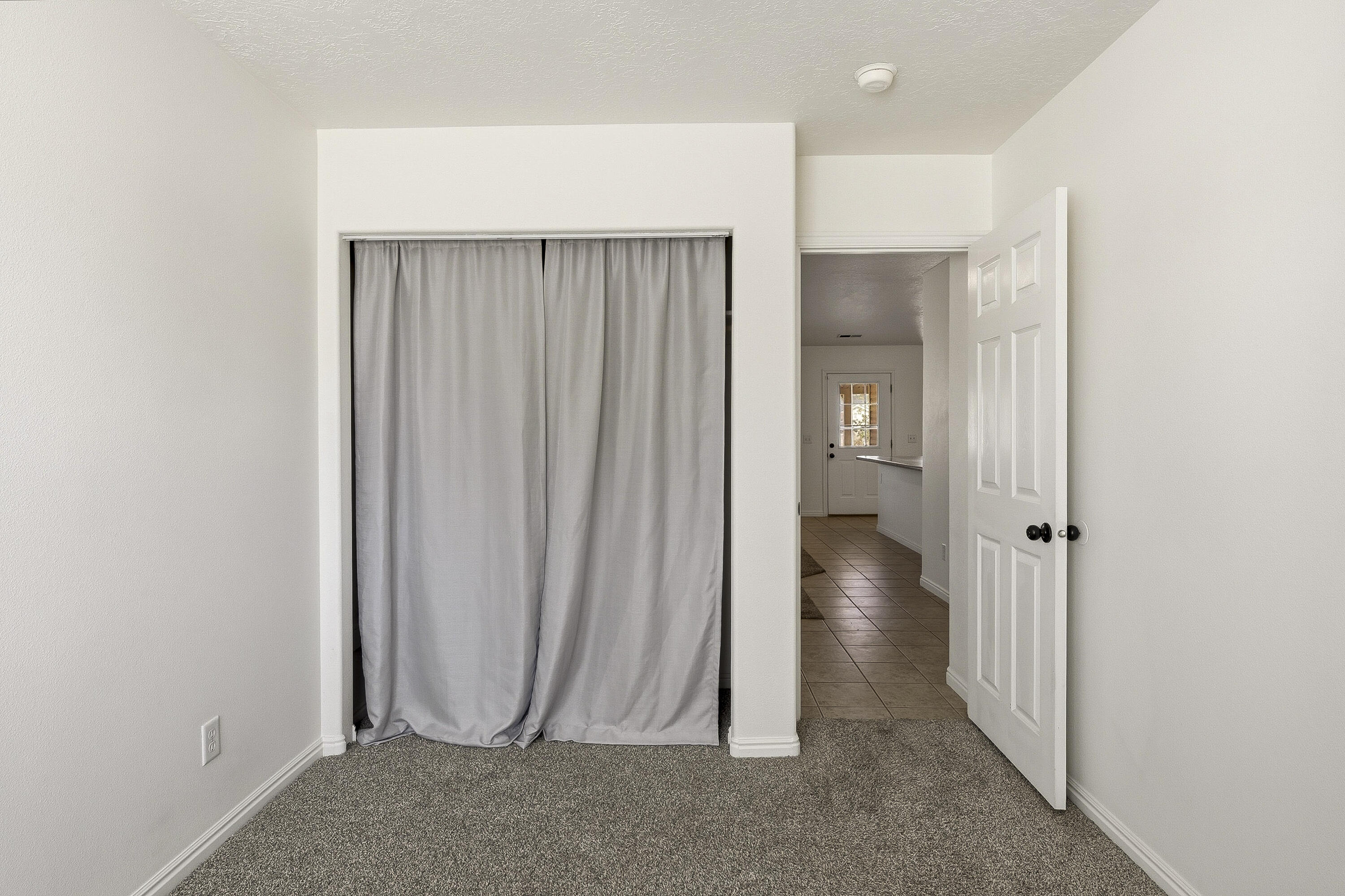 4510 North Half Mile Road Cedar City, UT 84721 - Photo 26 of 48 This bedroom is located right off the living room, making it great for a home office, craft room, playroom, or guest space.