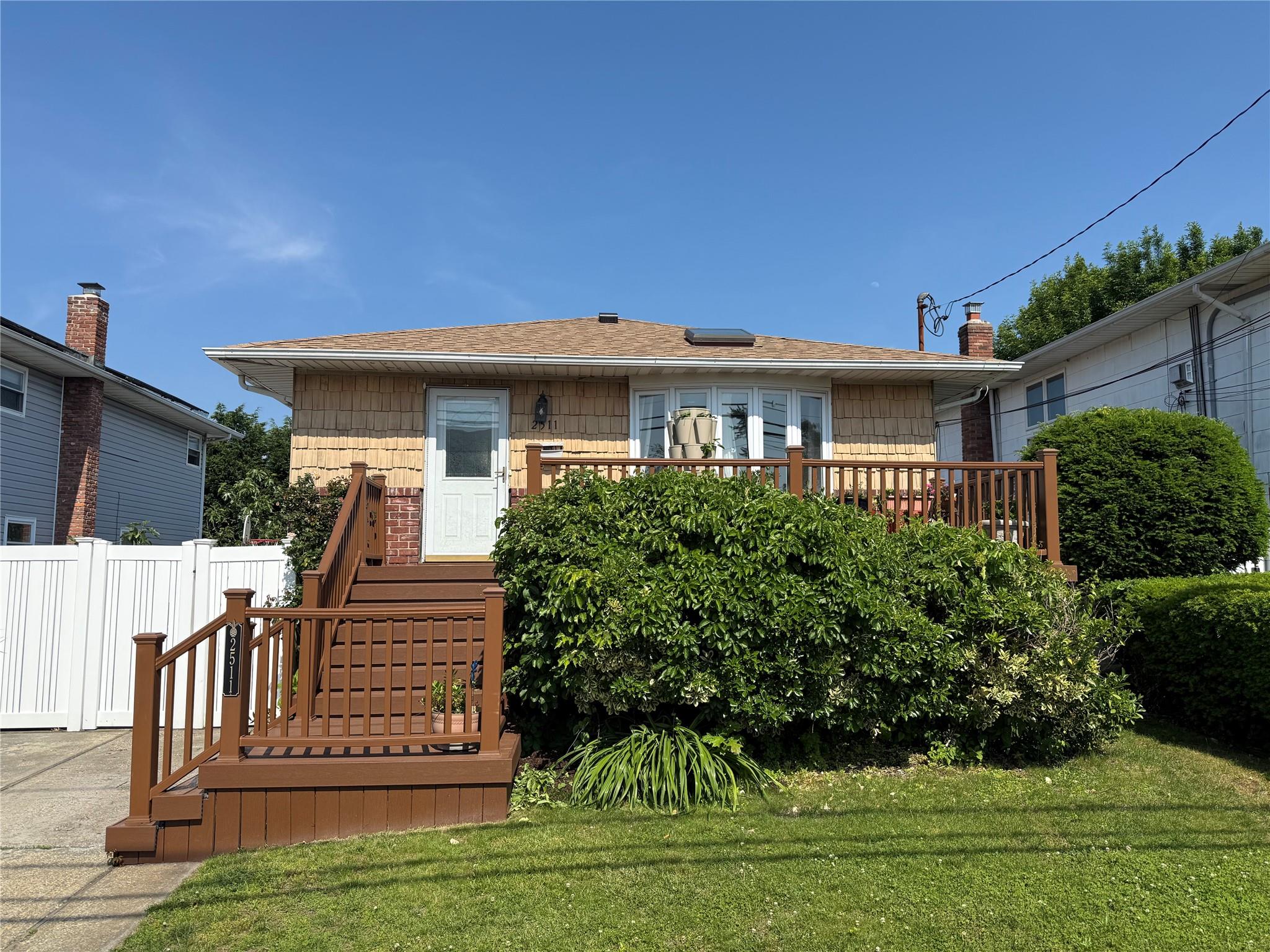 Rear view of house with roof with shingles